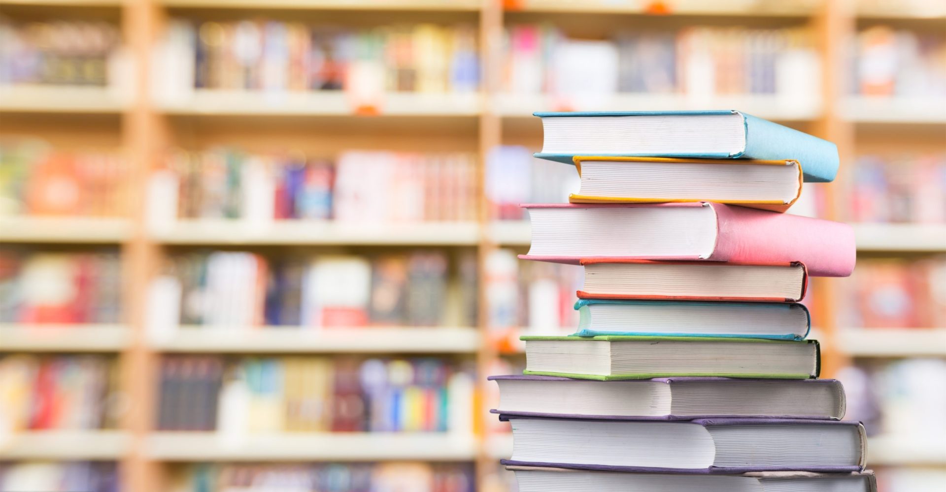 Opened,Book,On,A,Pile,Of,Old,Books,,Panorma,,Good